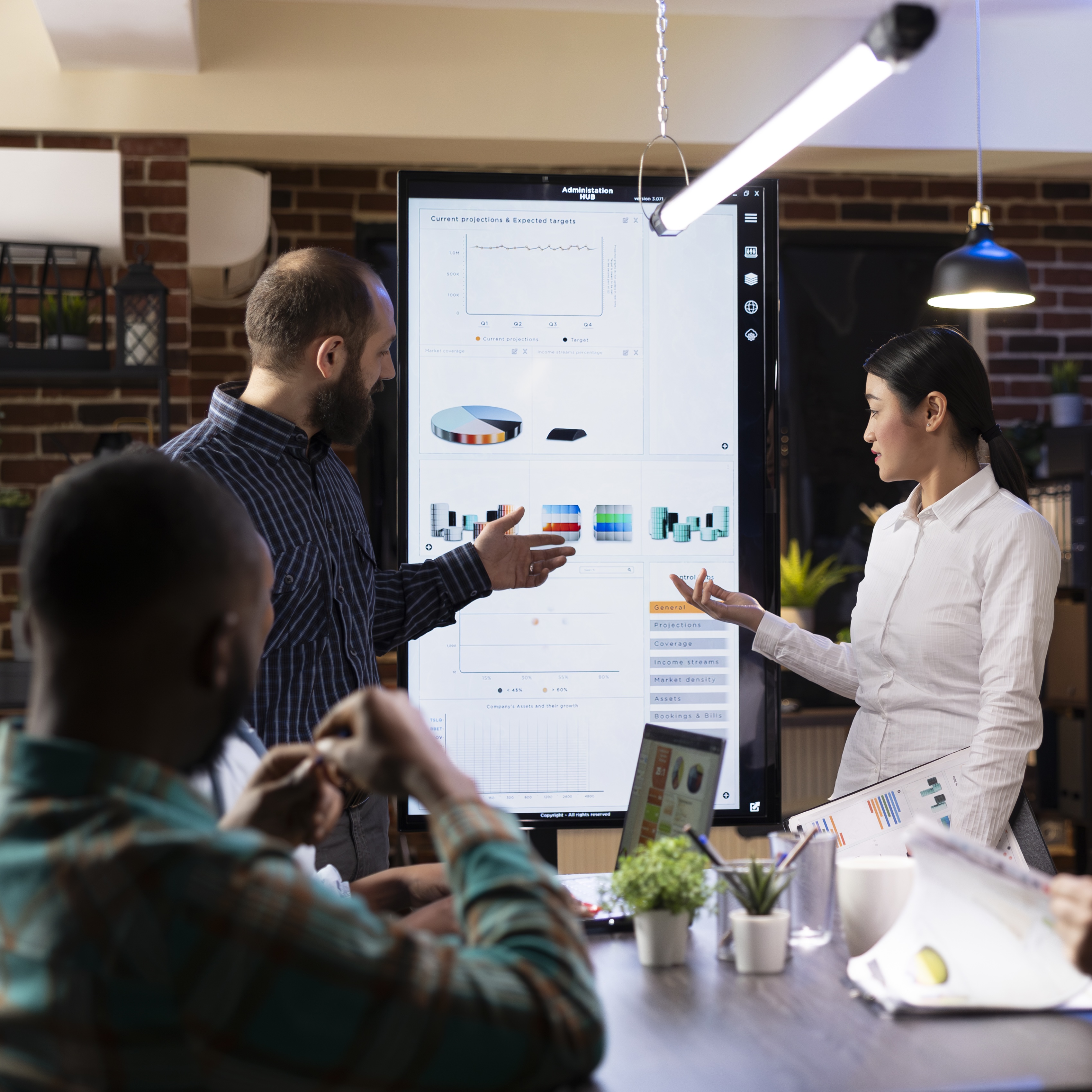 team-reviewing-marketing-strategies-digital-screen